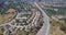 Timelapse Aerial of houses and highway in suburbs of san mateo county