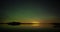 Timelapse of aurora borealis dancing over the lake