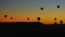 Timelapse of balloons at sunrise. Many balloonists at work, ride tourists in most touristic place in Turkey in region of