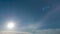 Timelapse of beautiful sun star in blue sky. slow moving clouds in clear atmosphere. solar energy of summer sun rays, sunbeams.