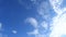 TimeLapse of beautiful sunny blue sky background with white cirrocumulus clouds