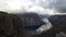 Timelapse of bird view of fjord in Norway with sunrays and clouds