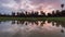 Timelapse black and white of angkor wat main entrace during the sunrise with reflection on the pond and cloud sky move fast