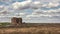 Timelapse of blue sky with white cumulus clouds above spring field.