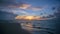 Timelapse :Bright sunset and cloudy over the sea. Dramatic clouds, waves splashes in the beach seaside, beautifully reflective sun