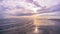 Timelapse :Bright sunset and cloudy over the sea. Dramatic clouds, waves splashes in the beach seaside, beautifully reflective sun