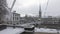 Timelapse busy traffic in european city at winter. City covered with fresh snow. View on Minster Bridge with Fraumunster Church