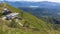 Timelapse cable-car operating during summer. Cable Car in the Swiss Alps with lake and mountains on the background. Monte Lema,