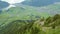 Timelapse cable-car operating during summer. Cable Car in the Swiss Alps with lake and mountains on the background. Stanserhorn,