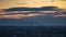 Timelapse city on a background of clouds at sunset