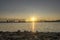 Timelapse of city river bank. Sun rays, blue sky and railway bridge over horizont. Summer sunrise time with flat tiny