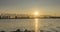 Timelapse of city river bank. Sun rays, blue sky and railway bridge over horizont. Summer sunset time with flat tiny