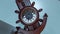 Timelapse of the clock in the shape of an anchor and a ship`s helm