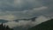 Timelapse. Clouds flowing round the hills of mountain range. Extreme long shot. Carpathians mountains, west Ukraine