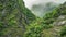 Timelapse of Clouds and High and Steep Marble Cliffs of Taroko Gorge National Park in Taiwan. View from Bottom to Top