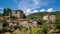 Timelapse clouds on medieval village and castle in tuscany. Italy