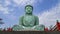 Timelapse of the clouds moving behind the replica statue of the Great Buddha of Kamakura in Japan, at Wat Phra That Doi Phra Chan