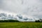 Timelapse clouds moving over the field. Spring landscape footage.