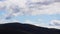 Timelapse of clouds passing by and weather changing over the mountains, shot in Tasmania over Mount Wellington also called Kunanyi