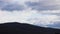 Timelapse of clouds passing by and weather changing over the mountains, shot in Tasmania over Mount Wellington also called Kunanyi