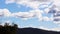 Timelapse of clouds passing by and weather changing over the mountains, shot in Tasmania over Mount Wellington also called Kunanyi