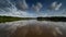 Timelapse of clouds reflected on pond in Everglades National Park 4K.
