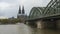 Timelapse of Cologne on Hohenzollern bridge and the Cathedral Dom on the background with boats passing on the Rhine river