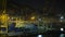 Timelapse of container traffic in industrial port at night, Spain