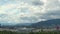 Timelapse cumulus clouds over hills. Fluffy, cotton balls in the sky. View from Hoengg, Zurich
