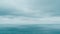 Timelapse of dark rain clouds moving in overcast grey sky over sea. Abstract aerial nature ocean sunset sea and sky