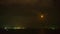 Timelapse of dramatic panorama of bright moon at sea in Thailand. Mysterious moon moving across sky