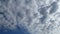 TimeLapse of Dramatic puffy fluffy white & dark gray cloud or cumulus cloudscape