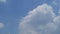 TimeLapse of Dramatic puffy fluffy white & dark gray cloud or cumulus cloudscape before thunderstorm or heavy rain on sunny daylig