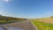 Timelapse driving car small village road, blue sky, summer ride