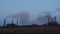 Timelapse factory smoke stacks billow, thick smoke.