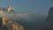 Timelapse with fast moving clouds over peaks in Dolomite