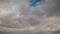 Timelapse - fast moving white clouds in the blue sky - cloudscape