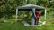 Timelapse of father and son man build summer bower in garden