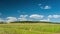 Timelapse field with clouds, a picturesque landscape with moving clouds over the fields.