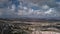 Timelapse of flying clouds on a blue summer sky over Uchisar valley with limestone hills