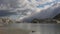 Timelapse of fog steam clouds moving over glacier lake. Melting glacier in the Swiss Alps. Rhone Glacier, the source of the river