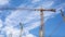 Timelapse footage of clouds in sky with construction crane