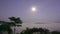 Timelapse Full moon reflecting bright light Above the sea of fog at dawn The time before sunrise