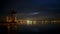 Timelapse Garda Lake at evening time with city lights, Italy
