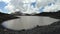 Timelapse gorge cliffs and mountain lake with moving sky shadows and clouds. North Caucasus. Russia