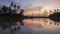 Timelapse gorgeous sunset over the architecture and coconut trees