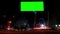 Timelapse highway night city. Greenkey billboard for advertisement at twilight time with light trails on the road at