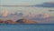 Timelapse hills under the clouds against the backdrop of the sea