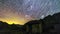 Timelapse isolated house in alps mountains milky way and star on the night sky with star trails over the polar stars