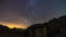 Timelapse isolated house in alps mountains milky way and star on the night sky with star trails over the polar stars